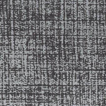 Textured cushion fabric, charcoal and light gray, with irregular vertical lines and scattered rectangular shapes creating a mottled pattern.