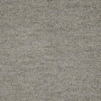 Woven fabric texture in medium gray, displaying a dense, granular surface with small raised loops and a matte finish; Tonelli design sample b002.