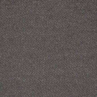 Gray woven textile texture with a granular, mottled surface; label reads "tonelli design > fabrics > fabric (b) > b012".
