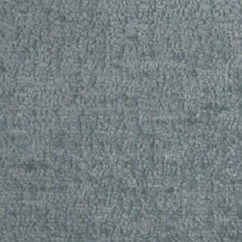 Looped pile fabric, muted gray-blue, nubby texture with horizontal weave lines; matte finish, studio sample with “tonelli design” label.