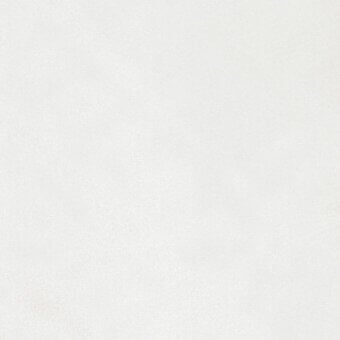 Off-white fabric swatch with a granular woven texture, displaying subtle shading and a partially visible label reading “turri > fabric cat. b > 744 a”.