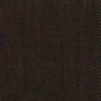Woven fabric sample, muted brown and golden-yellow, geometric interlocking pattern with raised texture and “turri” brand tag visible.