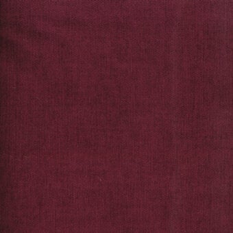 Burgundy fabric texture with a brushed weave, displaying Turri branding “754 o” and consistent color, illuminated by diffused light.