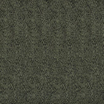 Olive-green textured fabric with charcoal accents, displaying a dense, irregular nubby weave and non-directional knotted pattern; label reads “turri 758 f”.