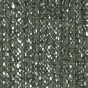 Olive-green tweed fabric sample with off-white fibers, dense irregular weave, and subtle tonal variations; “turri fabric 775 b” label.