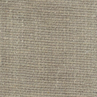Woven gray fabric texture with a dense, horizontal pattern and matte finish; includes printed text “turri > fabric cat. b > 777 b” and plant fragment.