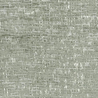 Sage green tweed fabric sample with silver highlights, dense woven texture, horizontal-vertical threads, and “turri” label visible.