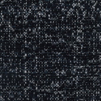 Woven teal fabric texture with white flecks, dense tweed-style pile, Turri brand label reading “781 m,” neutral background, even lighting.