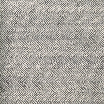 Chevron fabric texture, grayscale and off-white, dense repeating pattern with subtle sheen; Turri collection label visible: fabric cat. t > 756 b.
