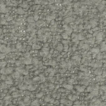 Woven gray fabric texture with looped pile, off-white grid, durable upholstery material, “turri > fabric cat. t > 765 e” label visible.