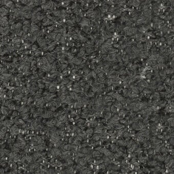 Dark charcoal gray tweed fabric texture with speckled flecks, dense weave, and matte finish; labeled “turri > fabric cat. t > 765 f.”