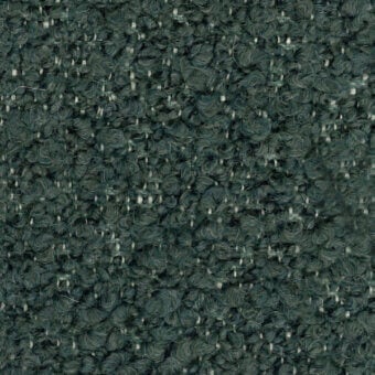 Dark green looped pile fabric sample with heathered cream fibers, tight irregular weave, textured nubby surface; labeled “turri > fabric cat. t > 765 g”.