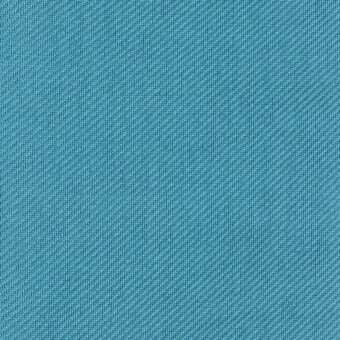 Turquoise woven fabric sample with diagonal texture, dense threads, and a visible label reading “turri > fabric cat. t > 767 d”.