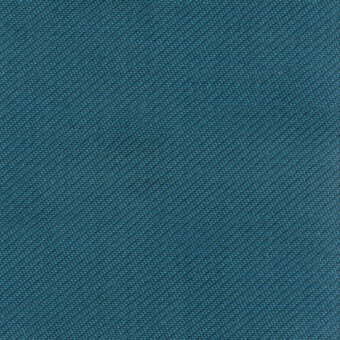 Teal blue fabric sample with a diagonal rib weave, dense texture, and matte finish; features embedded text “turri > fabric cat. t > 767 e”.