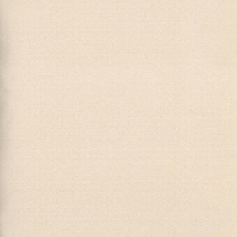 Beige fabric swatch with granular matte texture, small dark green label reading "turri > fabric cat. x > 657 a" in sans-serif font.