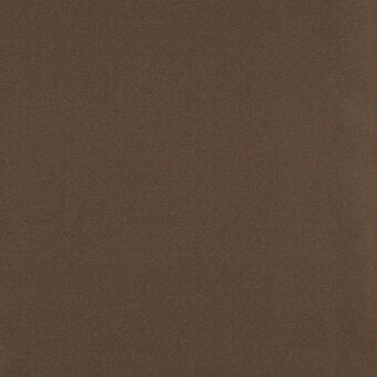 Medium-brown fabric texture with a tight weave and matte finish, displaying a “turri” brand label with category and code details.