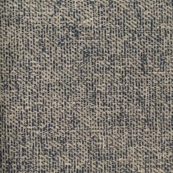 Woven fabric sample, beige and dark blue twill, irregular nubby texture with mottled pattern, white label reading “turri > fabric cat. x > 753 e”.