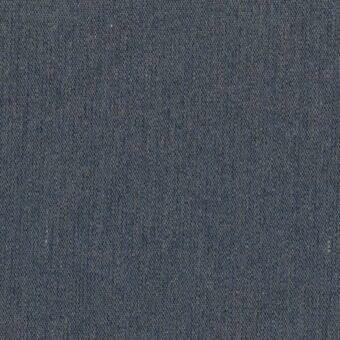 Denim blue woven fabric texture with a matte finish, displaying a subtle irregular weave and dense uniform coloration for upholstery.