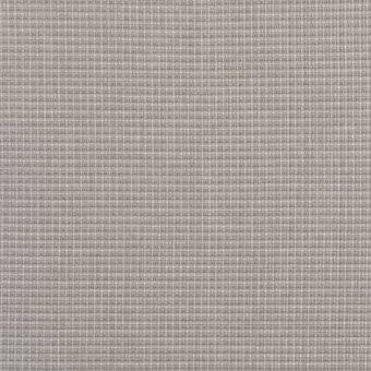 Vela Grigio fabric sample displays a muted gray woven grid pattern with beige and darker gray threads, featuring a dense, matte texture.