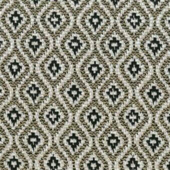 Geometric textile sample features dark green diamonds within beige outlines, a dense woven pattern with visible horizontal and vertical threads.