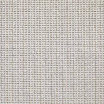 Beige and tan geometric fabric sample with repeating diamond motifs, dense weave, textured nubby surface, and creamy off-white background.