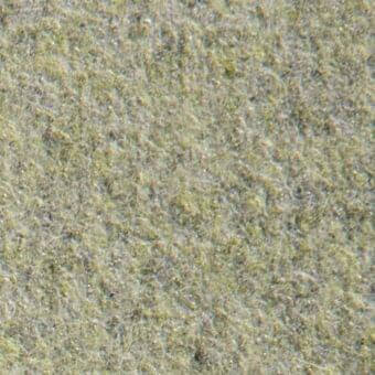 Gray-green fibrous texture with scattered yellowish-gold speckles, displaying an irregular, organic surface and subtle height variation.