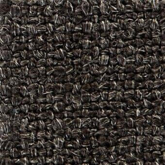 Dark gray woven fabric texture with a nubbed, heathered surface; includes “verzelloni,” “fabric,” “elbrus” identifiers within the weave.