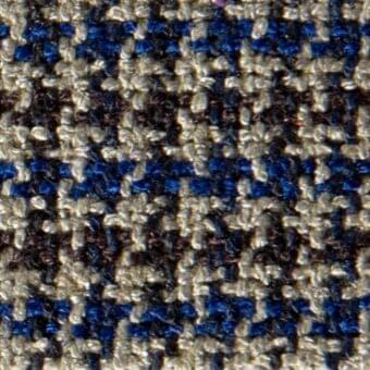 Glen plaid fabric texture with deep blue, gray, and beige woven twill; dense, nubby surface creates a traditional, complex pattern.