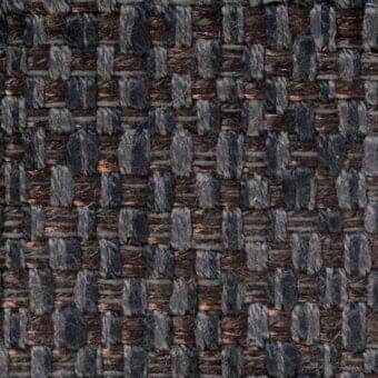 Woven fabric texture, charcoal gray and copper-brown, irregular grid pattern with a basket weave and subtle sheen, textile sample verzelloni indo 17022.