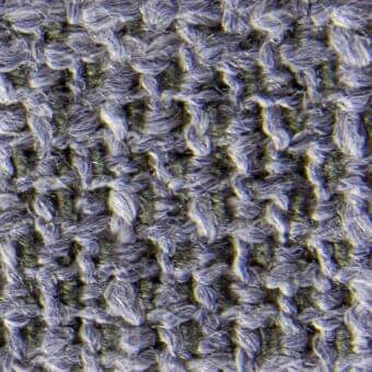 Ribbed fabric texture in gray and olive green tones, dense weave with visible fibers, slightly rough surface, suitable for upholstery.