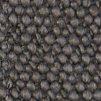 Dark gray verzelloni fabric texture with a raised, nubby looped pile weave and heathered tonal variations.