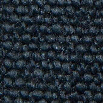 Dark blue Vezzelloni Mila 20008 fabric displaying a dense, repeating raised nodule pattern with subtle tonal variations and a tight weave.