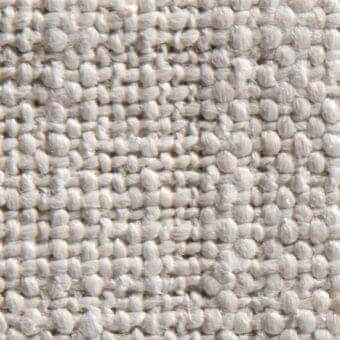 Norah 15023 fabric texture, light beige woven material, nubby irregular surface with heathered tonal variations and raised knot pattern.