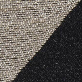Diagonal fabric texture sample featuring light gray grid weave above dense black velvet, creating contrasting surfaces and a sharp division.