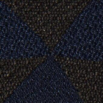 Woven tartan fabric with navy blue and golden-brown intersecting diagonal lines, dense wool blend texture, subtle sheen, diamond blocks.