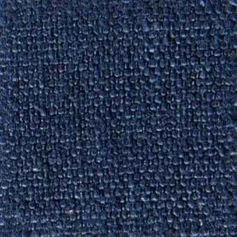 Dark blue fabric texture with repeating circular nodules, exhibiting a matte, slightly rough surface and organic, tactile quality.