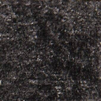 Serapi fabric sample, dark gray woven textile, irregular fiber texture with mottled appearance and light gray flecks.