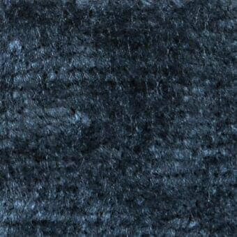 Dark blue-gray woven fabric texture with a rough, felt-like surface and mottled tone; label reads "verzelloni > fabric > serapi 18026".