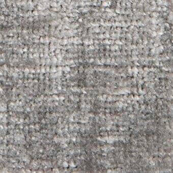 Distressed gray woven fabric texture with horizontal stripes, nubby weave, and granular surface; resembles vintage wool or Serapi rug fragment.