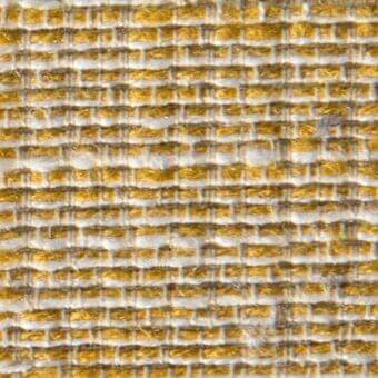 Woven fabric texture features muted gold and off-white horizontal stripes in a tight grid, with “verzelloni” text integrated at the lower left.