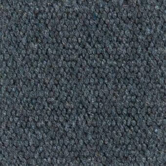 Looped fabric texture, cool gray with heathered effect, short pile with scattered dark blue fibers, durable wool blend material.