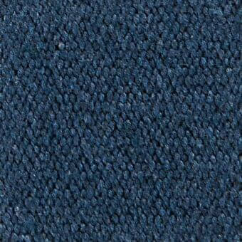 Blue woven fabric texture with a granular, nubby surface; displays manufacturer detail “verzelloni dylan 19050” and tonal fiber variations.