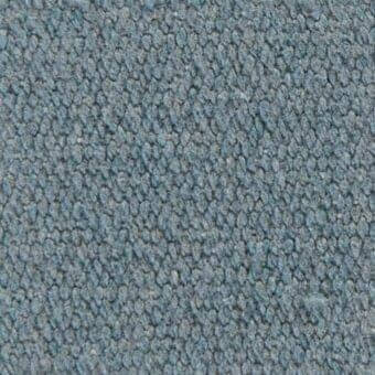 Verzelloni fabric texture, blue-gray, dense nubby fibers with matte finish and granular pattern, looped pile construction.