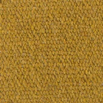 Mustard yellow fabric texture with a dense, nubby weave and rounded protrusions, displaying a granular surface and subtle tonal variations.