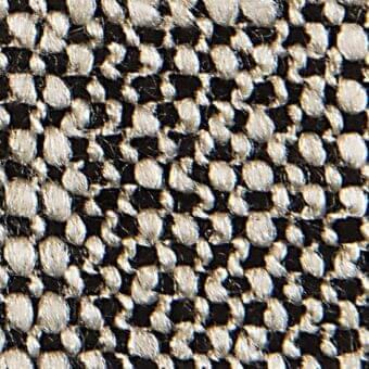 Woven fabric texture, black and off-white yarns, irregular checkerboard pattern with looped knots, durable construction, verzelloni gent 18007.