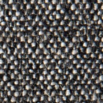 Woven fabric texture, black and gray yarns, grid pattern, dense weave, matte finish, textile sample with “verzelloni joni 15048” text.
