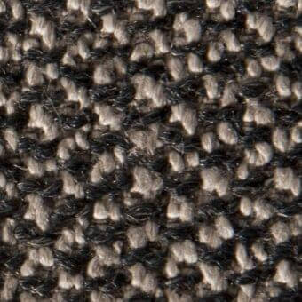 Woven tweed texture with charcoal gray and beige yarns forming a dense, irregular pattern and slightly raised, nubby surface.