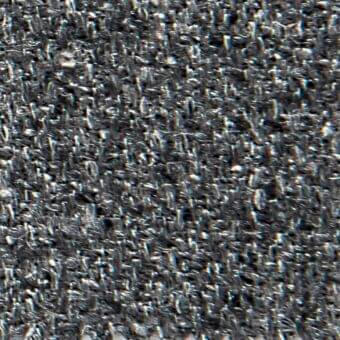 Dark gray woven fabric texture with irregular weave, visible fibers, and subtle sheen; includes fragmented text “verzelloni,” “fabric,” “liam.”