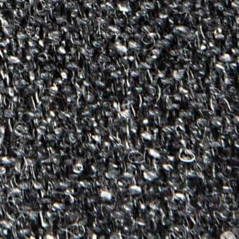 Dark gray woven fabric texture with irregular weave, subtle sheen, and interspersed light gray highlights; appears durable and tactile.