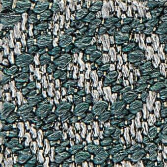 Teal and off-white woven fabric texture displays looped and straight yarn, creating a dense, nubby pattern with subtle color variations.